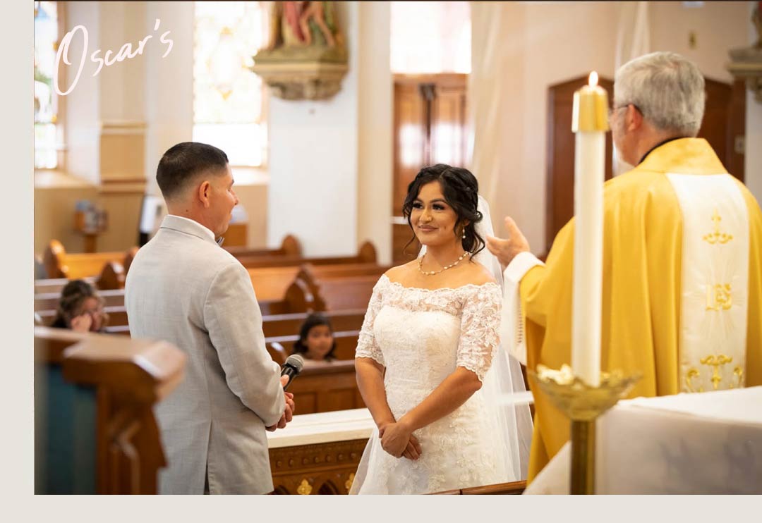 Bride and groom exchanging vows during a Catholic wedding ceremony at the altar, church wedding photography Ventura County
