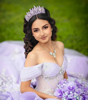 Quinceañera close-up portrait in a lavender off-the-shoulder gown with a beaded bodice and matching tiara, holding a lilac rose bouquet